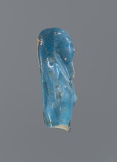 Shabti, Mummy-shaped figurine, funerary offering. Supported on a pillar at the back. Legs missing.