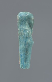 Shabti, Mummy-shaped figurine, funerary gift; supported at the back on a pillar. Legs missing from