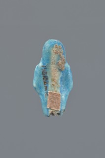 Shabti, Mummy-shaped figurine, funerary gift, supported on a pillar at the back. Legs missing. Arms