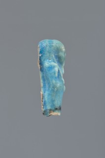 Shabti, Mummy-shaped figurine, funerary gift; supported on a pillar at the back. Legs missing. Arms