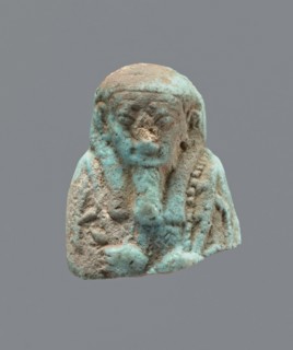 Ushabti - upper part of a figurine. Mummy-shaped funerary figurine ushabti, head and torso fragment