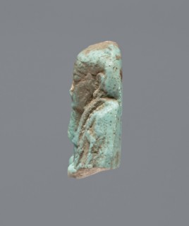 Ushabti - upper part of a figurine. Mummy-shaped funerary figurine, head and torso fragment.