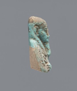 Ushabti - upper part of a figurine. Mummy-shaped figurine, funerary gift; head and torso fragment.