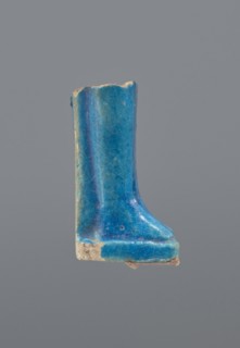 Shabti legs, mummy-shaped figurine, funerary gift. Fragment of the legs preserved from the knees