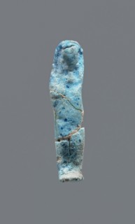 Shabti, mummy-shaped figurine, funerary gift. Legs missing. Arms crossed on the chest. Hands