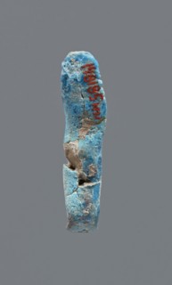 Shabti, mummy-shaped figurine, funerary gift. Legs missing. Arms crossed on the chest. Hands