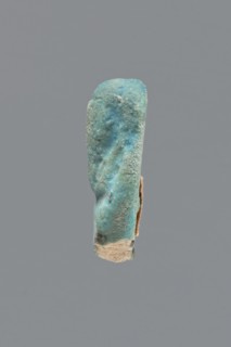 Shabti, Mummy-shaped figurine, funerary gift. Legs missing. Arms crossed on the chest, hands