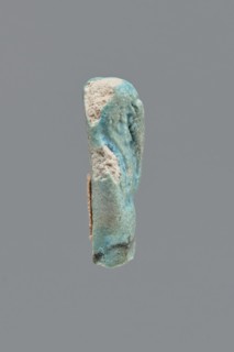 Shabti, Mummy-shaped funerary figurine, legs missing. Arms crossed on the chest, hands invisible