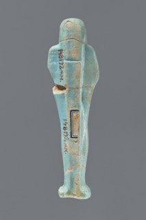 Ushabti, Mummy-shaped figurine, standing on a base with a narrow, slightly convex pillar at the