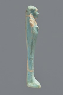 Ushabti, Mummy-shaped figurine. Standing on a base with a flat pillar at the back. Arms folded