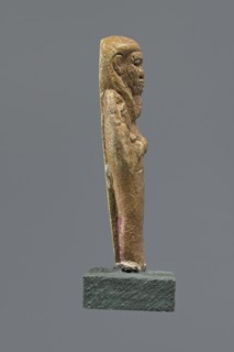 Shabti, Mummy-shaped figurine standing on a base, back supported by a pillar/pilaster. Arms crossed