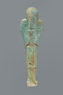 Ushabti, Mummy-shaped figurine shabti. Standing on a base with a flat pillar behind it. Arms folded