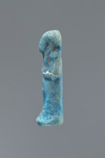Ushabti, mummy-shaped figurine impressed in a mold, carelessly made of faience. The back is flat