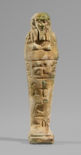 Ushabti, Mummy-shaped funerary figurine, standing on a base and supported at the back by a flat,