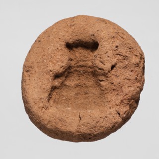 A mold for making an amulet — Bes mask, Bes myth.; mask amulet casting; mold; height 0.4 cm;