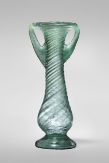 Unguentarium, unknown Eastern workshop. Glass vessel, transparent light green, Barag type VII: 1, 3