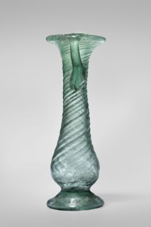 Unguentarium, unknown Eastern workshop. Glass vessel, transparent light green, Barag type VII: 1,