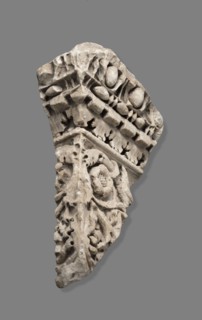 Fragment of architectural decoration. Corner section of a fragment made in relief. The cornice is