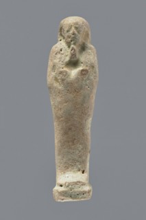 Ushabti, mummy-shaped figurine, funerary gift, hoes. Mummy-shaped figurine standing on a base, back