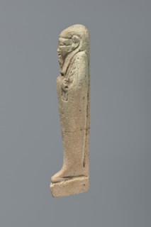 Ushabti, Mummy-shaped figurine, standing on a base with the back supported by a flat pillar. Arms