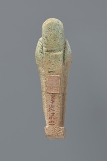 Ushabti, Mummy-shaped figurine, standing on a base, the back supported by a flat pillar. The arms