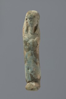 Ushabti, Mummy-shaped figurine, very schematically shaped. Hands crossed on the chest. On the head