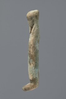 Ushabti, Mummy-shaped figurine, very schematically shaped. Hands crossed on the chest. On the head