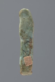 Ushabti, Mummy-shaped figurine, very schematically shaped. Hands crossed on the chest. On the head