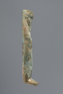 Ushabti, Mummy-shaped figurine, funerary gift, hoes. Very schematically shaped; hands crossed on