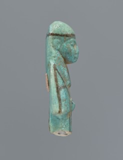 Ushabti, mummy-shaped figurine, preserved upper fragment from the waist up. Arms crossed on the