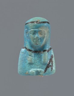 Ushabti, Mummy-shaped figurine, preserved head and fragment of torso. Arms crossed on the chest,