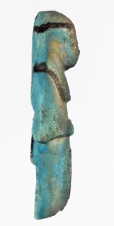 Shabti with baskets on the back. Mummy-shaped funerary figurine, preserved fragment from the knees