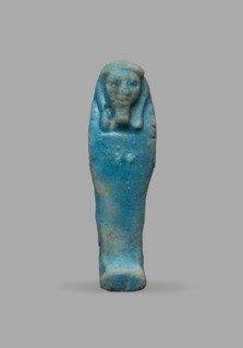 Ushabti, Wigs, funerary figurine, grave goods, mummy-shaped figurine. The arms are not distinct,