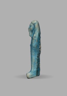 Ushabti, Mummy-shaped funerary figurine, wig, funerary figurine, grave good. The arms are not