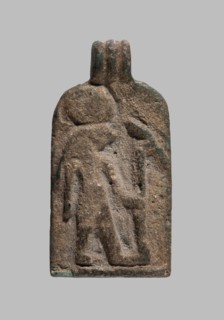 Amulet plaque with the figure of Re: plaque with a flat relief figure of a falcon-headed deity with
