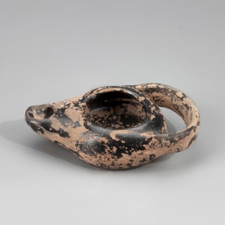Black-finished lamp, unknown Attic workshop. Lamp made on a wheel. Circular, flattened vessel with