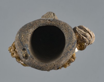 Apotropaic pendant in the shape of a male head; bearded head pendant; Carthage Tunisia; technique