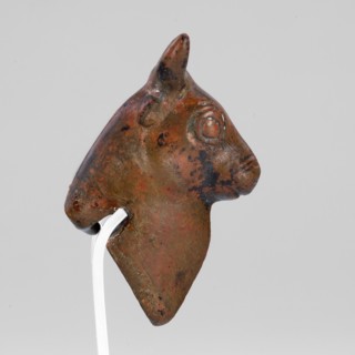 Bull-headed protoma, vessel decoration, unknown Urartian workshop. Stylized bull's head with linear