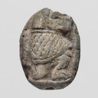 Scaraboid with a monkey. The upper surface of the scaraboid is decorated with a convex image of a