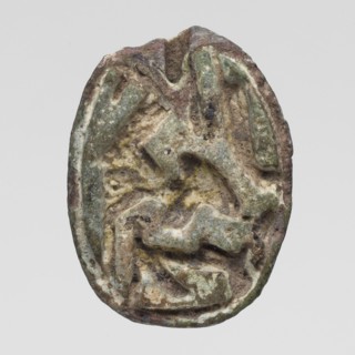 Scaraboid with a monkey. The upper surface is decorated with a convex image of a seated baboon