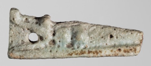 Amulet — reclining crocodile with tail bent at the end, head slightly raised; hanging hole