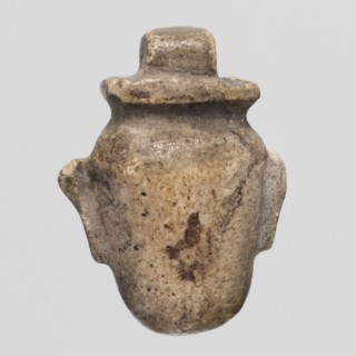 Amulet - heart ib; Amulet ib in the shape of a heart with a pendant at the top; maker, materials