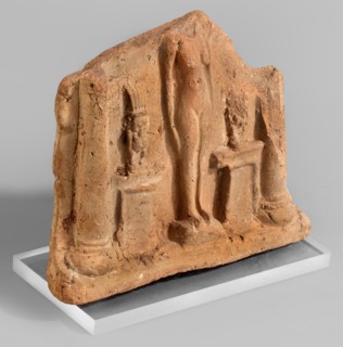Fragment of a votive plaque in the form of a naos with the fertility goddess Isis-Hathor, and Bes;,
