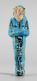 Amenhotep's shabti with baskets on the back; hieroglyphs; headbands; wigs; baskets; hoes; grave