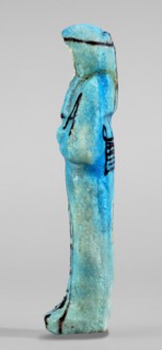 Amenhotep's shabti with baskets on the back; hieroglyphs; headbands; wigs; baskets; hoes; grave
