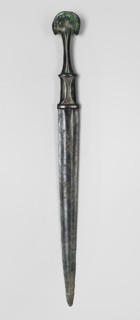 Dagger, unknown Luristan workshop. A fully cast Luristan bronze dagger with a full hilt and a