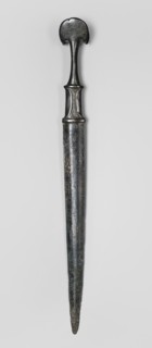 Dagger, unknown Luristan workshop. A fully cast dagger with a full hilt and a flared pommel. The