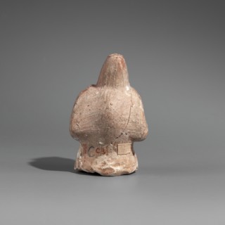 Hunchback puppet, Figurine hollow inside. Hunchbacked torso with a large head in a pointed cap set