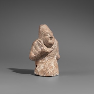 Hunchback puppet, Figurine hollow inside. Hunchbacked torso with a large head wearing a pointed cap
