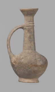 Jug, Cypriot pottery, Base Ring Ware I. Jug with an echinus-shaped foot; a biconical, slightly